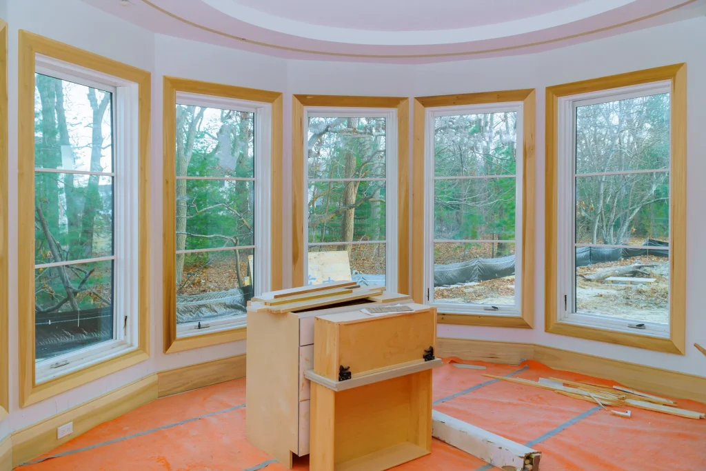 A construction of newly built window frames and glass.